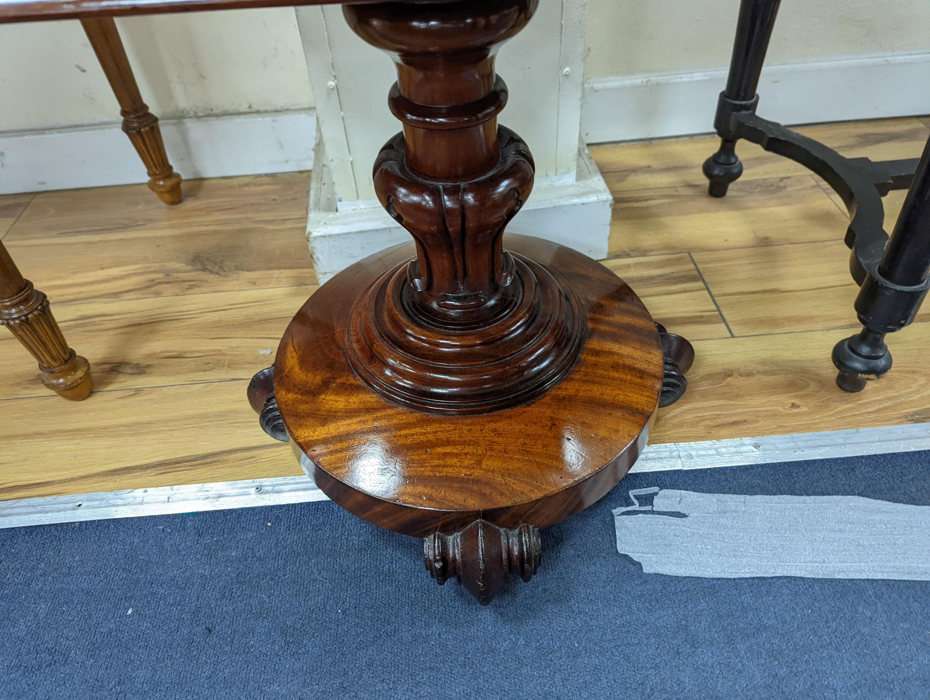 A mid Victorian sarchophagus shaped mahogany teapoy, width 52cm, depth 35cm, height 73cm